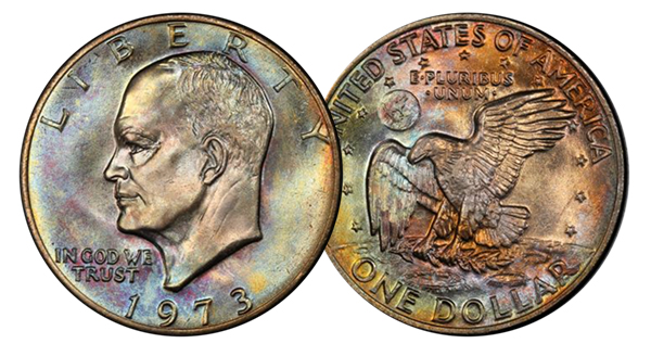 1973 Eisenhower dollar dramatically off-center strike showing blank planchet area and partial Eisenhower portrait with visible date